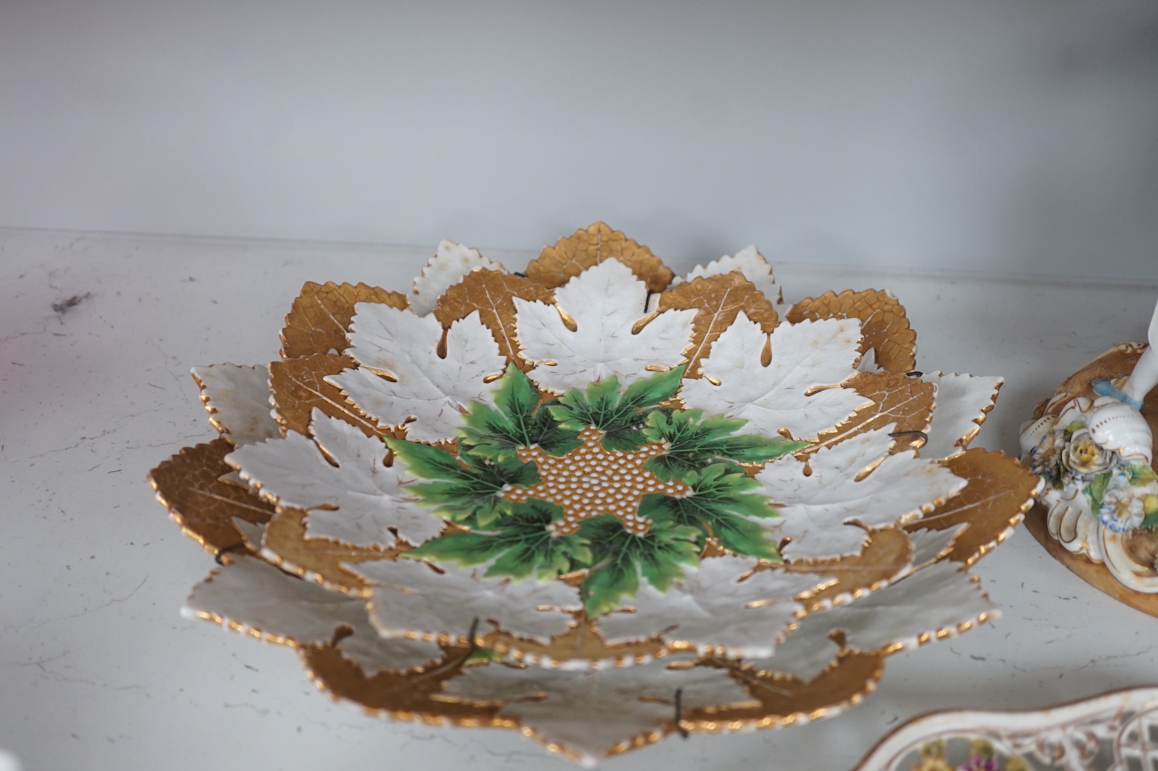 Two Meissen leaf dishes, a Dresden plate, two group figures and mixed ceramics, tallest 25cms high